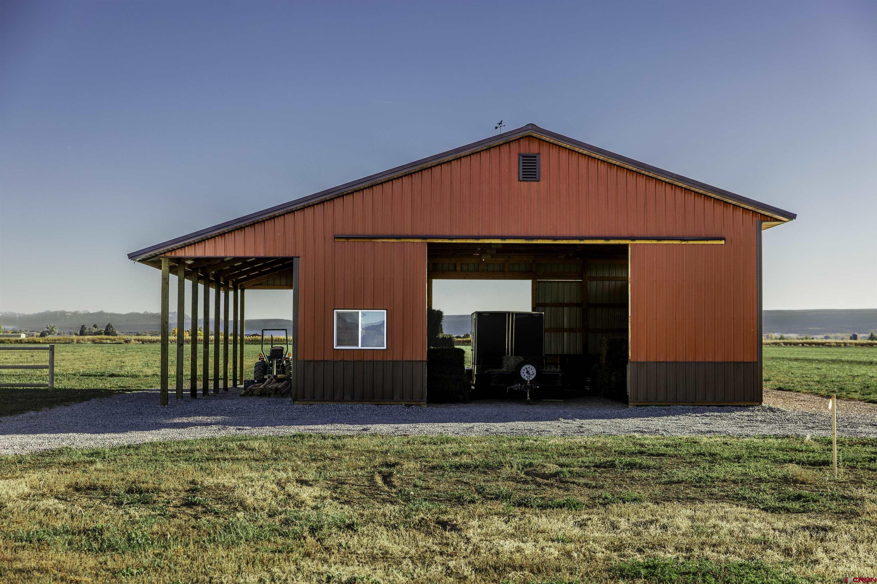 697 Grand Vista Road Delta, CO 81416 - Photo 5 of 44 a front view of a house with a yard