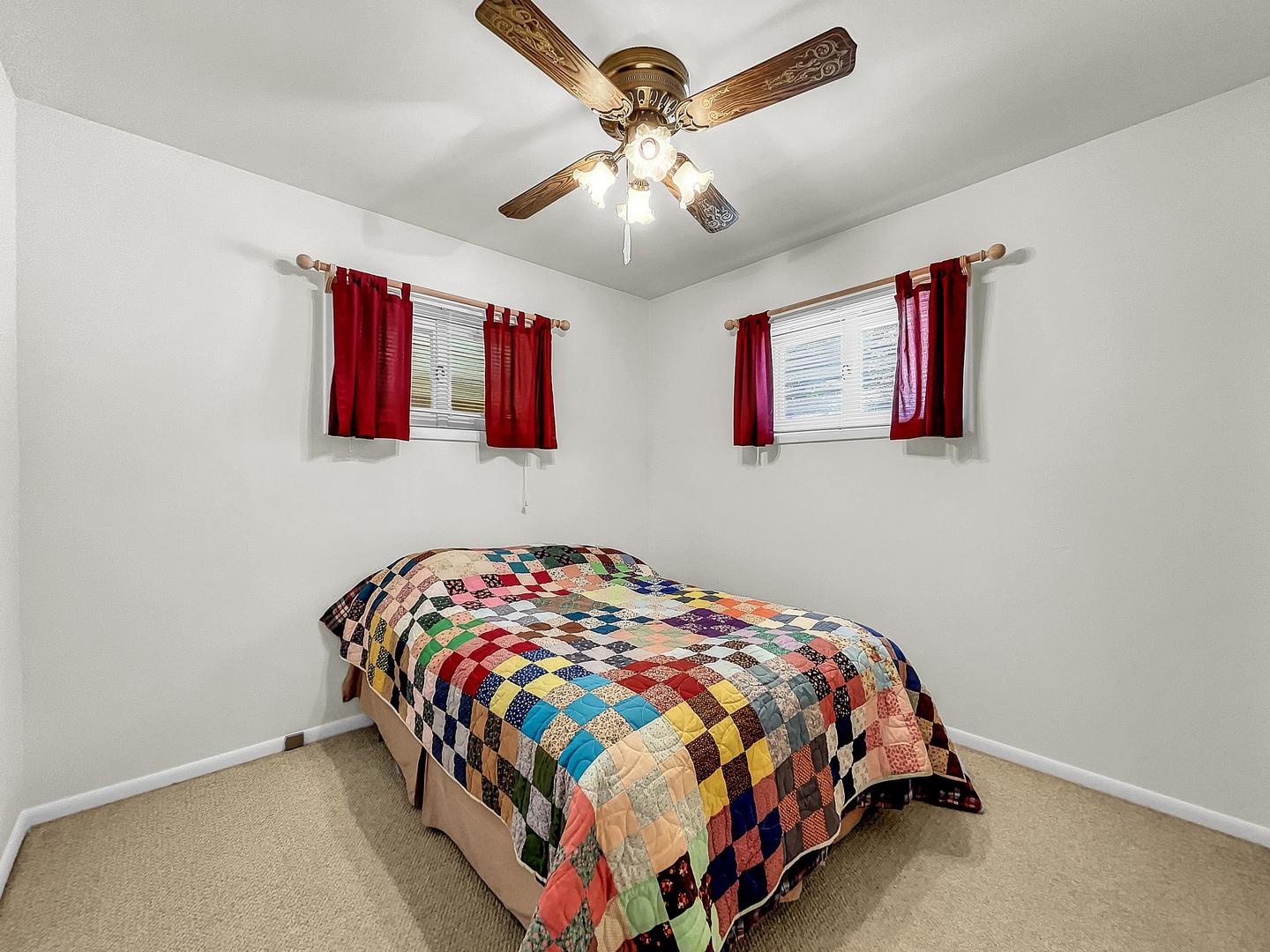 841 Rinear Road Antioch, IL 60002 - Photo 16 of 20 a bedroom with a bed and painting on the wall