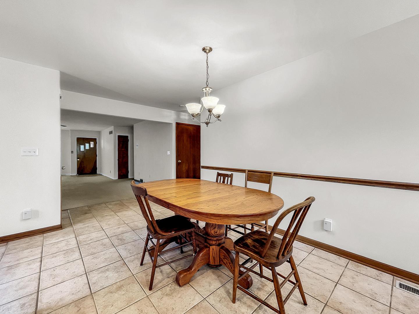 841 Rinear Road Antioch, IL 60002 - Photo 8 of 20 a dining room with a table and chairs