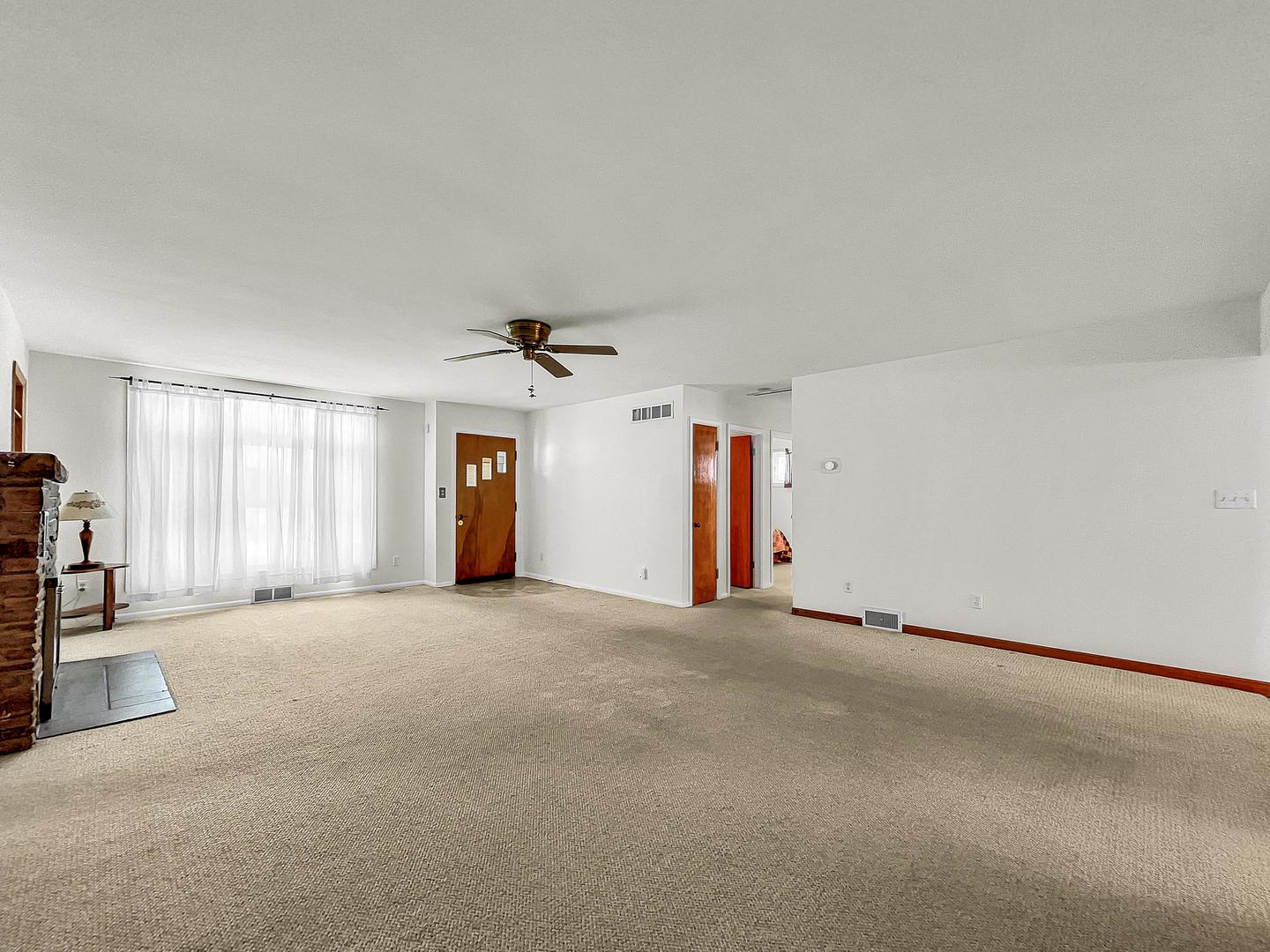 841 Rinear Road Antioch, IL 60002 - Photo 9 of 20 a view of a livingroom with an empty space and a window