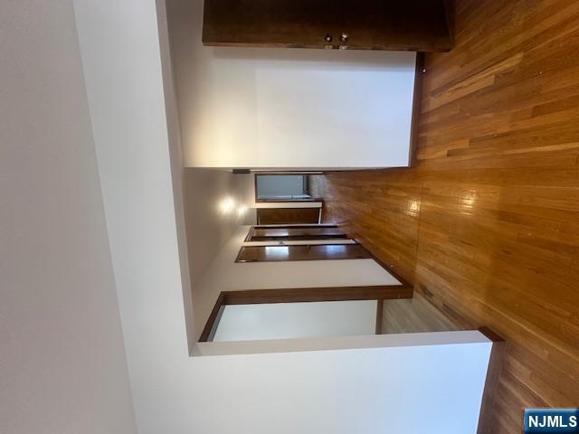 124 Johnson Avenue, Unit 2 Wallington, NJ 07057 - Photo 13 of 17 a view of a hallway with wooden floor