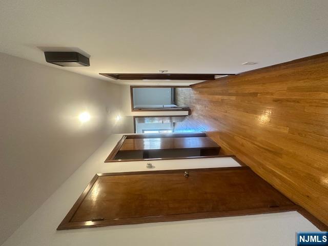 124 Johnson Avenue, Unit 2 Wallington, NJ 07057 - Photo 15 of 17 a view of hallway with wooden floor