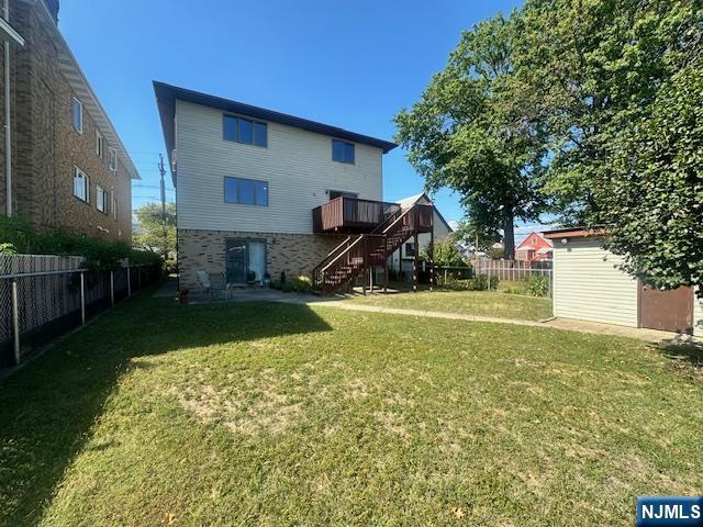 124 Johnson Avenue, Unit 2 Wallington, NJ 07057 - Photo 4 of 17 a view of a house with a yard