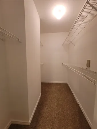 a view of a hallway with closet