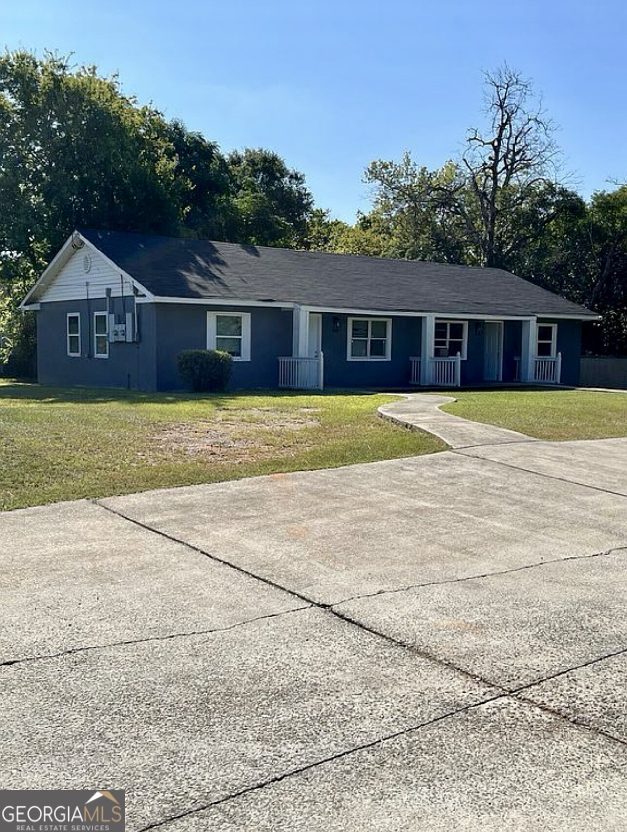 361 Woolfolk Street Macon, GA 31217 - Photo 2 of 7 a front view of a house with a yard and trees