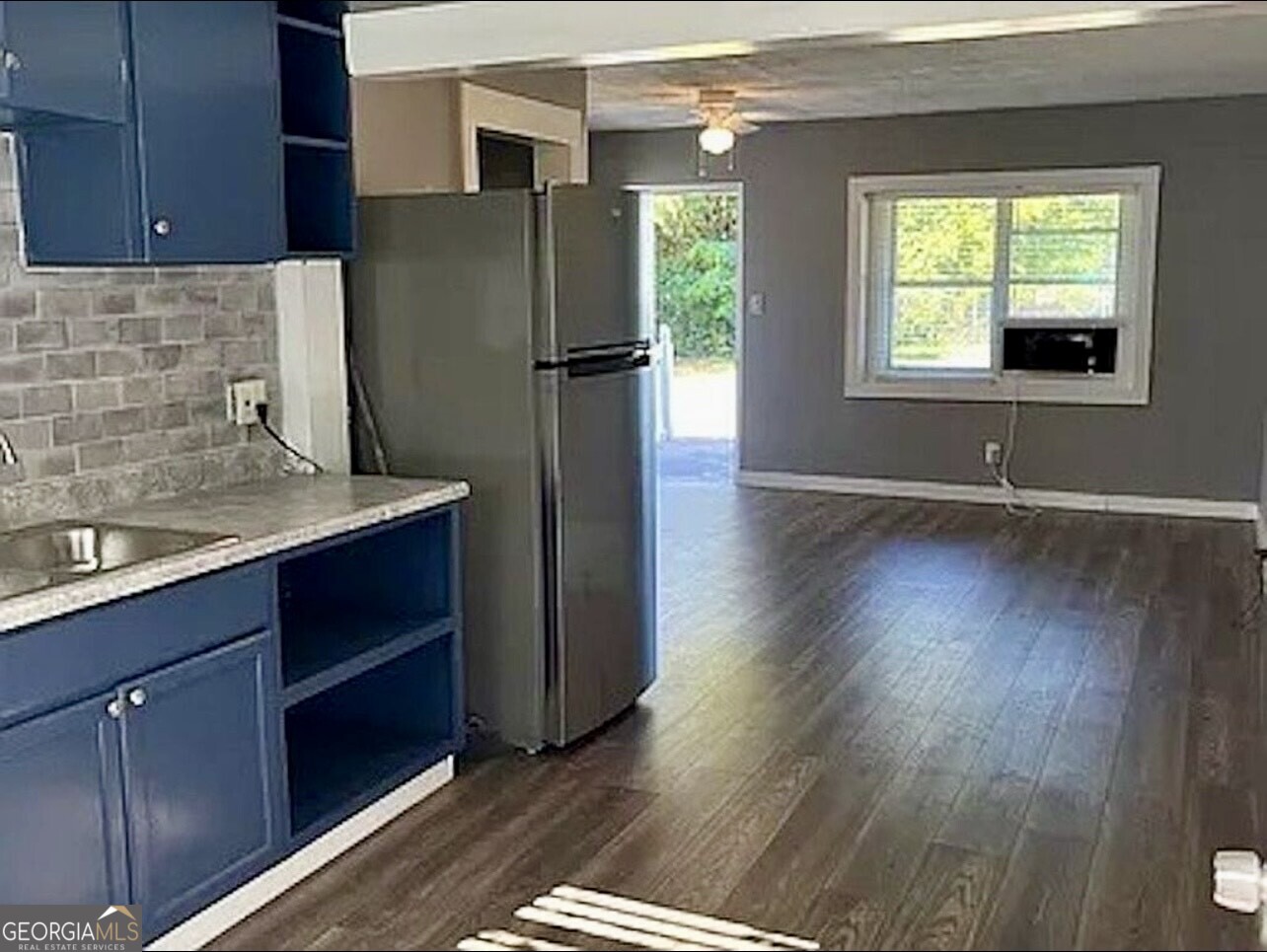 361 Woolfolk Street Macon, GA 31217 - Photo 5 of 7 a kitchen with stainless steel appliances granite countertop a refrigerator and a sink