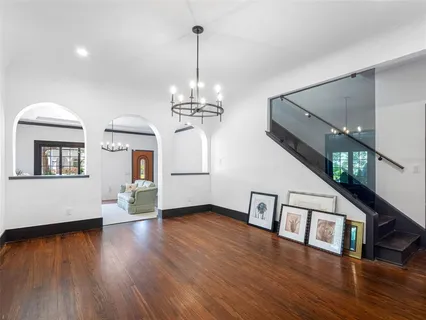 a kitchen with stainless steel appliances granite countertop a stove and a wooden floors