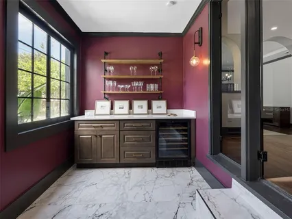 a bedroom with a bed and a flat tv screen