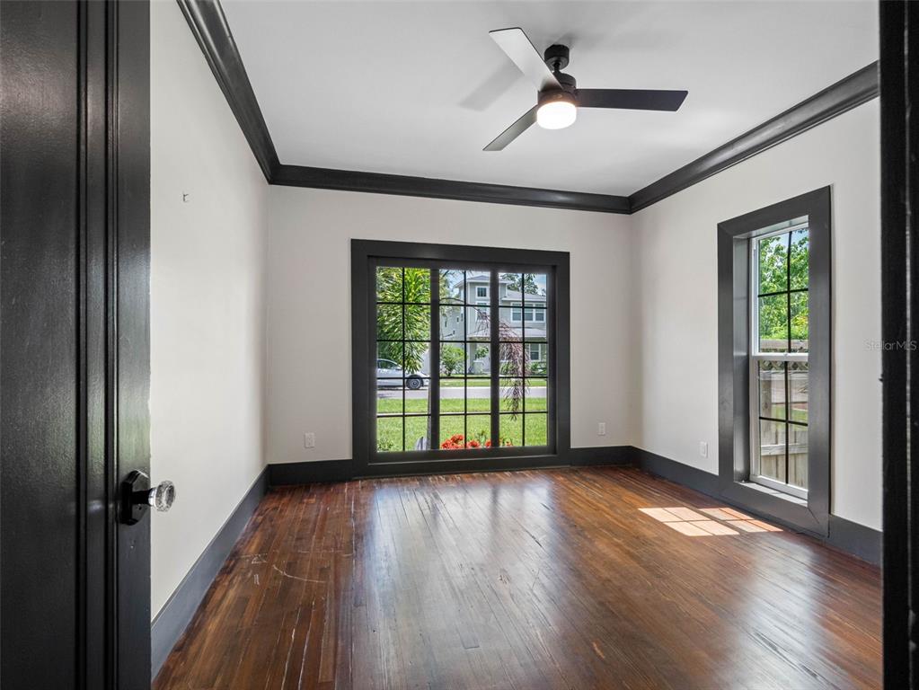 1570 48th Avenue North St. Petersburg, FL 33703 - Photo 21 of 75 wooden floor in an empty room with a window