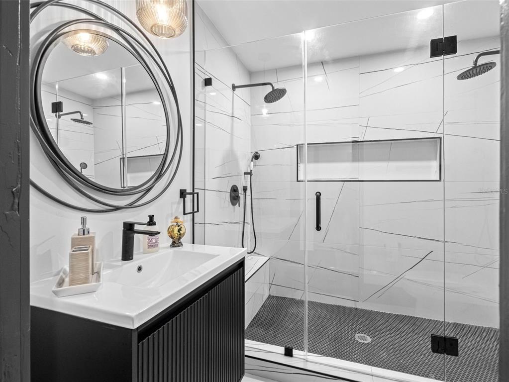 1570 48th Avenue North St. Petersburg, FL 33703 - Photo 31 of 75 a bathroom with a sink vanity and a mirror