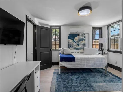 a front view of a house with a yard and a garage