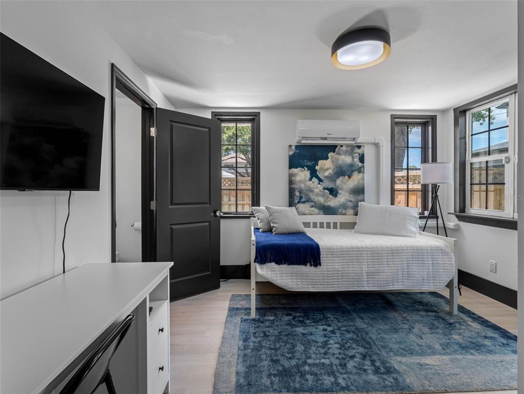 1570 48th Avenue North St. Petersburg, FL 33703 - Photo 33 of 75 a living room with furniture and a flat screen tv