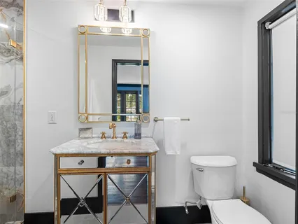 an aerial view of a house with a yard swimming pool outdoor seating and yard