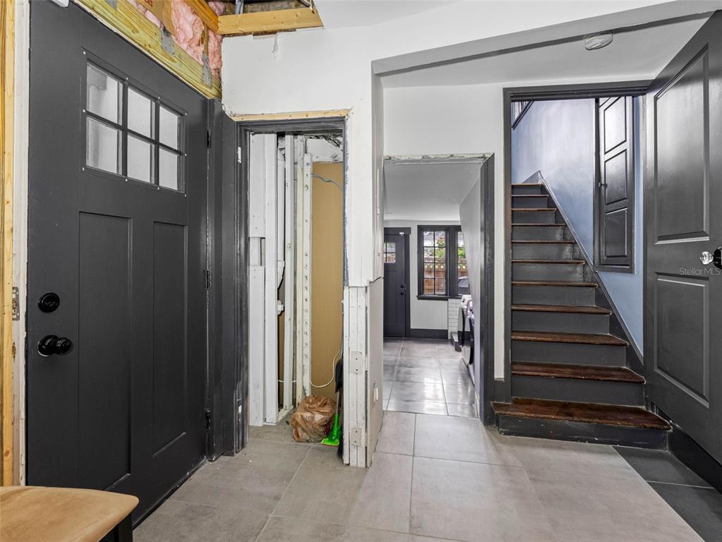 1570 48th Avenue North St. Petersburg, FL 33703 - Photo 48 of 75 a view of a hallway with wooden floor and staircase