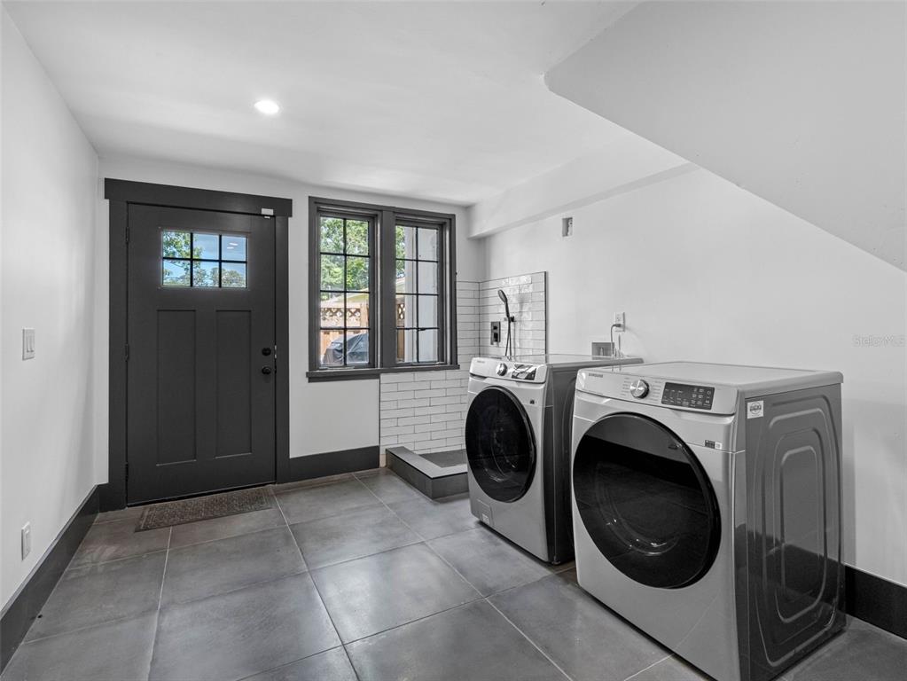 1570 48th Avenue North St. Petersburg, FL 33703 - Photo 49 of 75 a view of a hallway with washer and dryer
