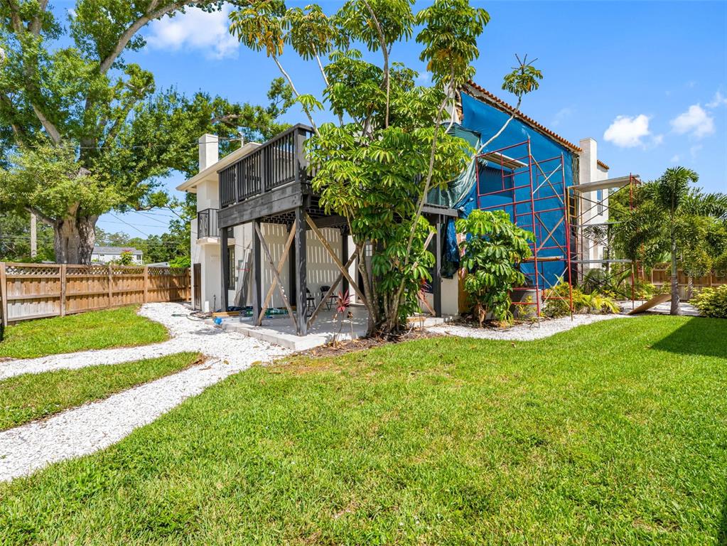 1570 48th Avenue North St. Petersburg, FL 33703 - Photo 54 of 75 a view of a house with backyard and a tree