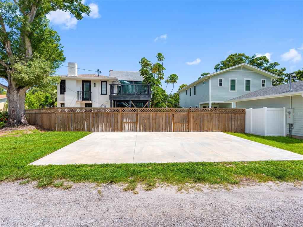 1570 48th Avenue North St. Petersburg, FL 33703 - Photo 55 of 75 a front view of a house with a yard and a garage