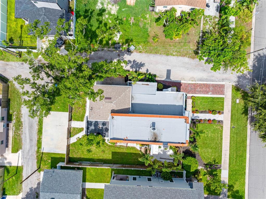 1570 48th Avenue North St. Petersburg, FL 33703 - Photo 62 of 75 an aerial view of a house with a yard swimming pool outdoor seating and yard