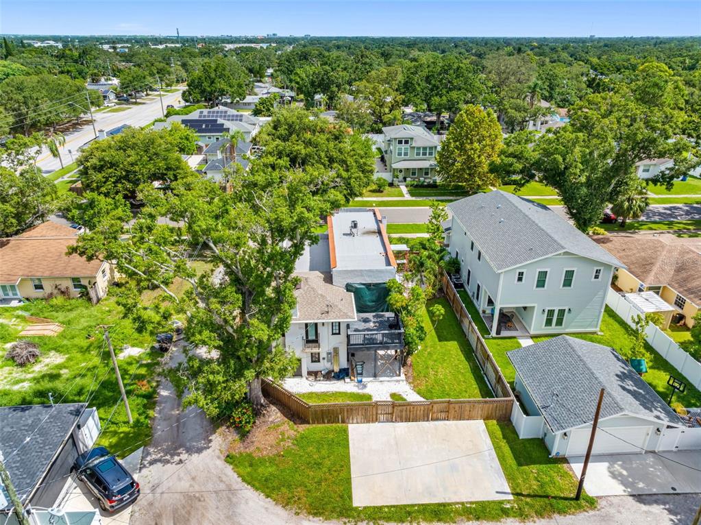 1570 48th Avenue North St. Petersburg, FL 33703 - Photo 65 of 75 an aerial view of residential houses with outdoor space and trees