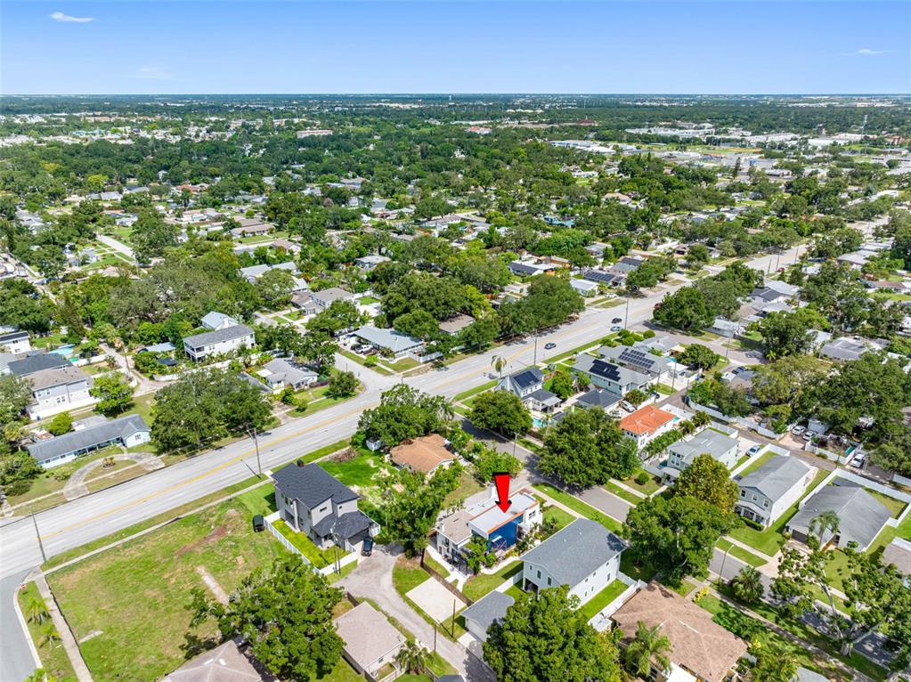 1570 48th Avenue North St. Petersburg, FL 33703 - Photo 69 of 75 an aerial view of residential houses with outdoor space and trees