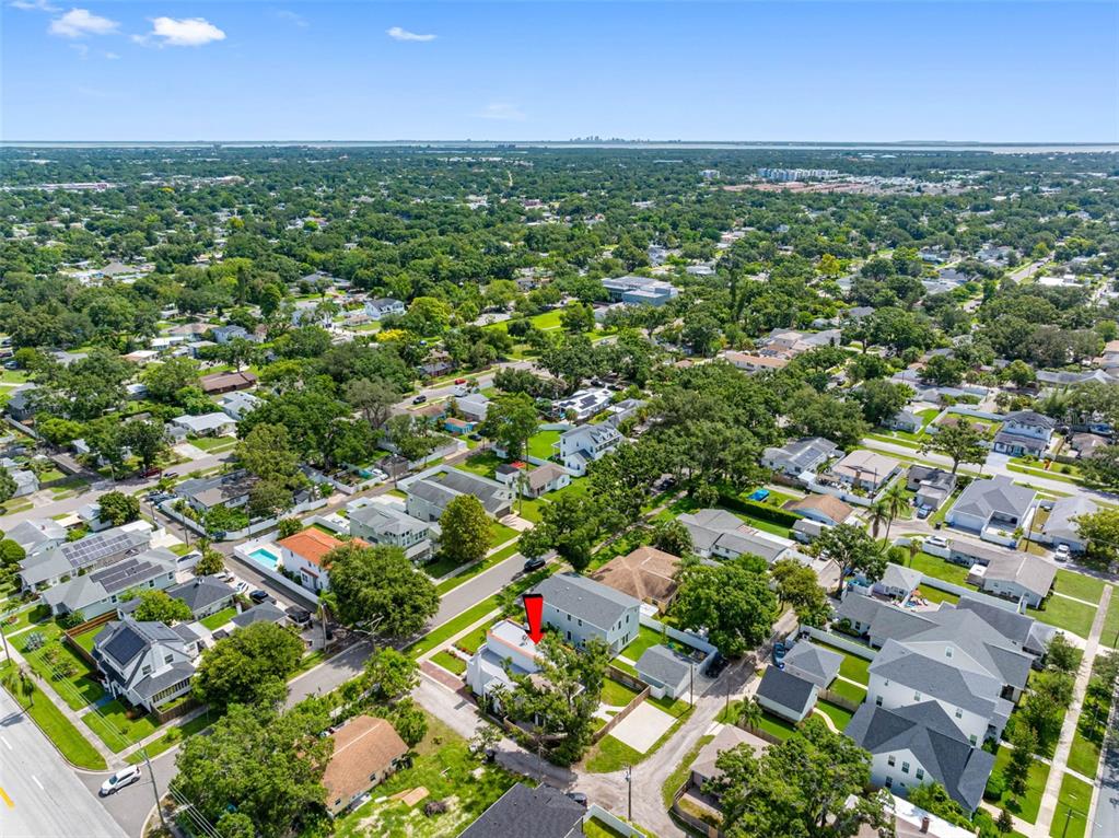 1570 48th Avenue North St. Petersburg, FL 33703 - Photo 71 of 75 an aerial view of residential houses with outdoor space and trees
