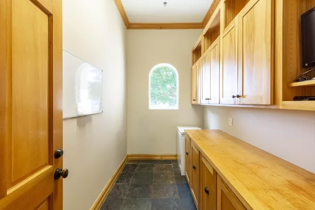 a bathroom with a granite countertop sink a toilet and shower