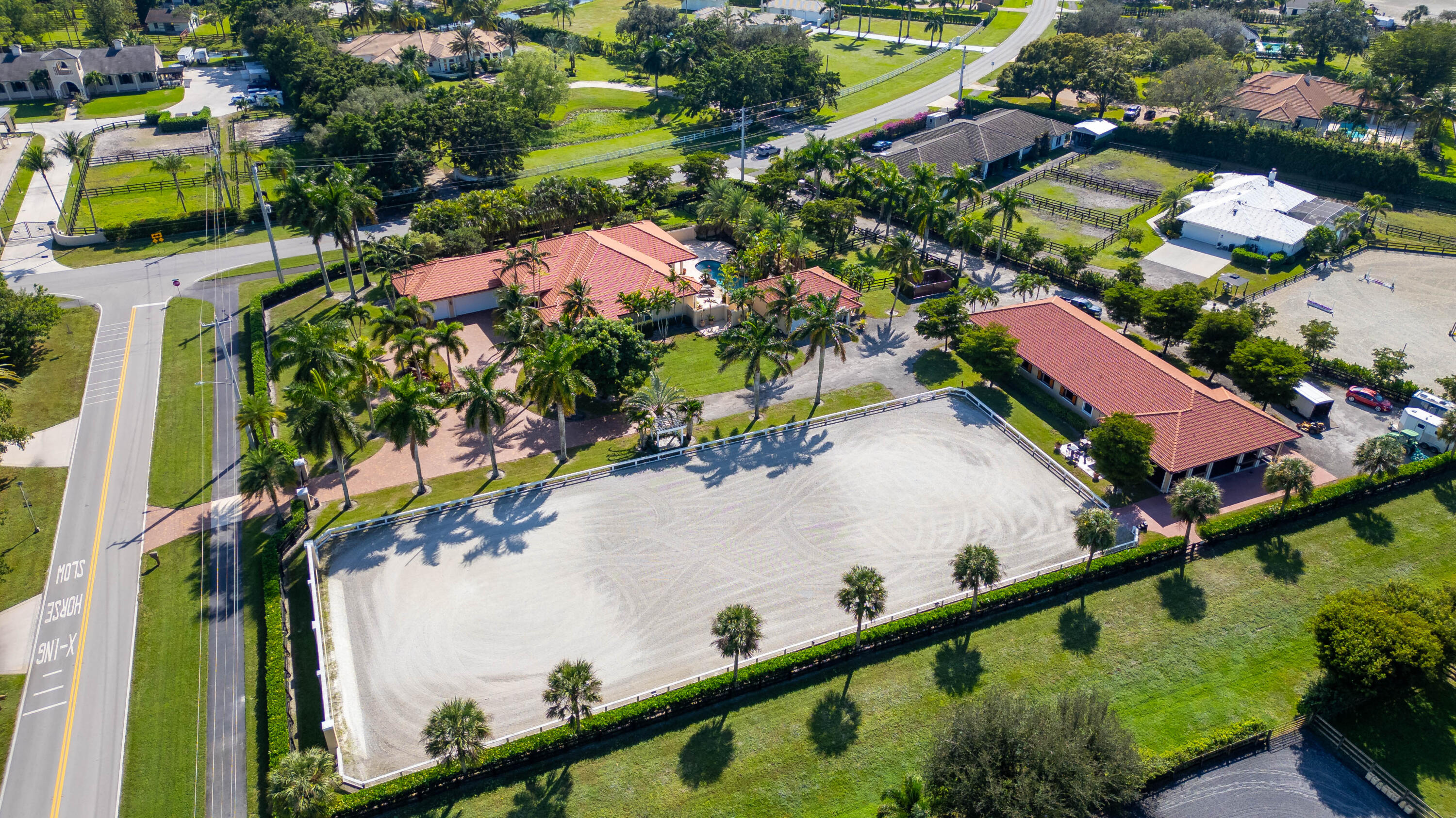 14943 Paddock Drive, Unit STALLS AND ) Wellington, FL 33414 - Photo 2 of 41 an aerial view of a house
