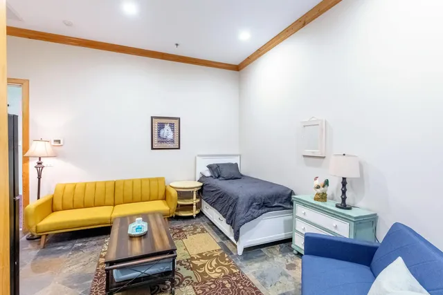 a kitchen with a sink and a refrigerator