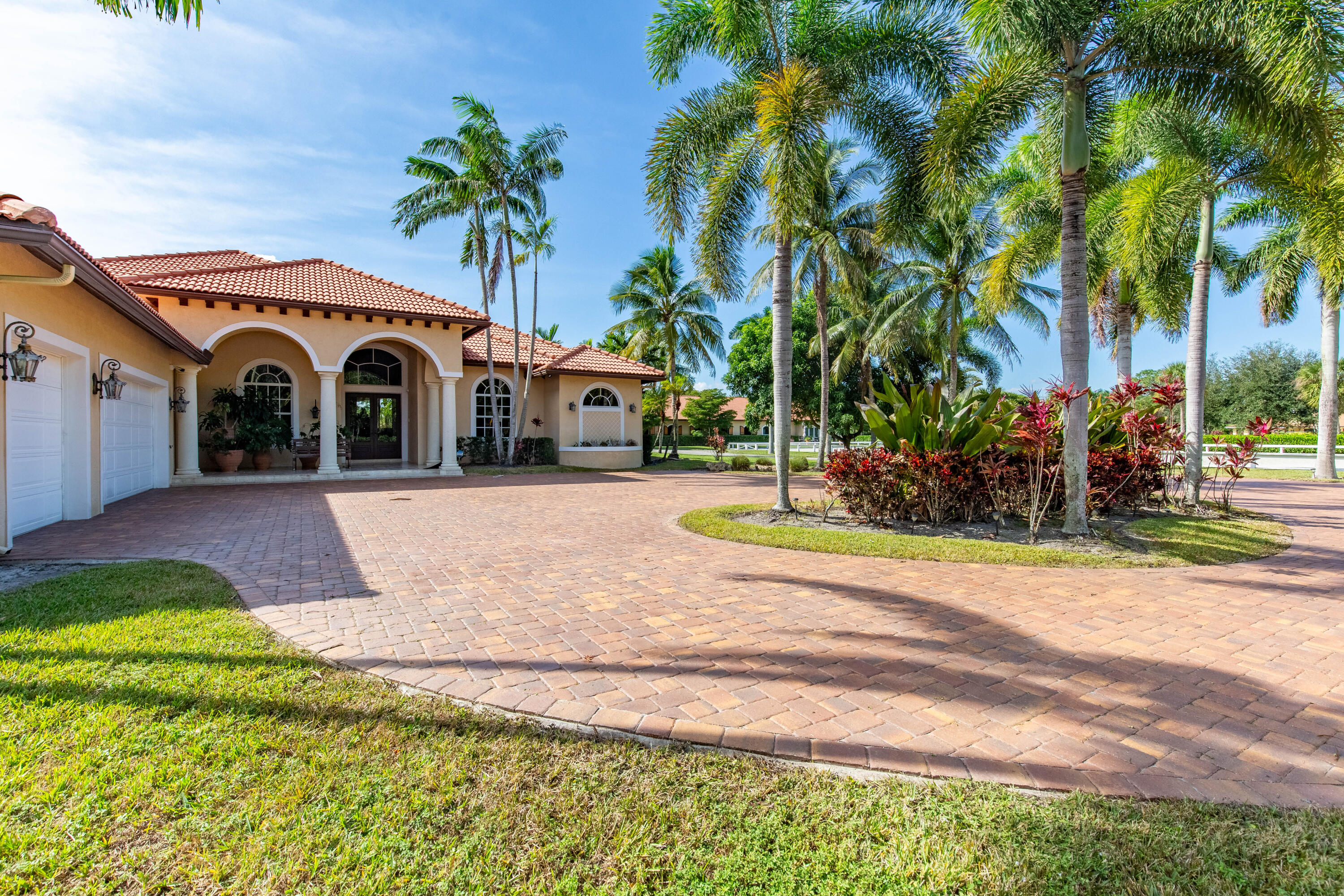 14943 Paddock Drive, Unit STALLS AND ) Wellington, FL 33414 - Photo 33 of 41 a view of front a house with a yard