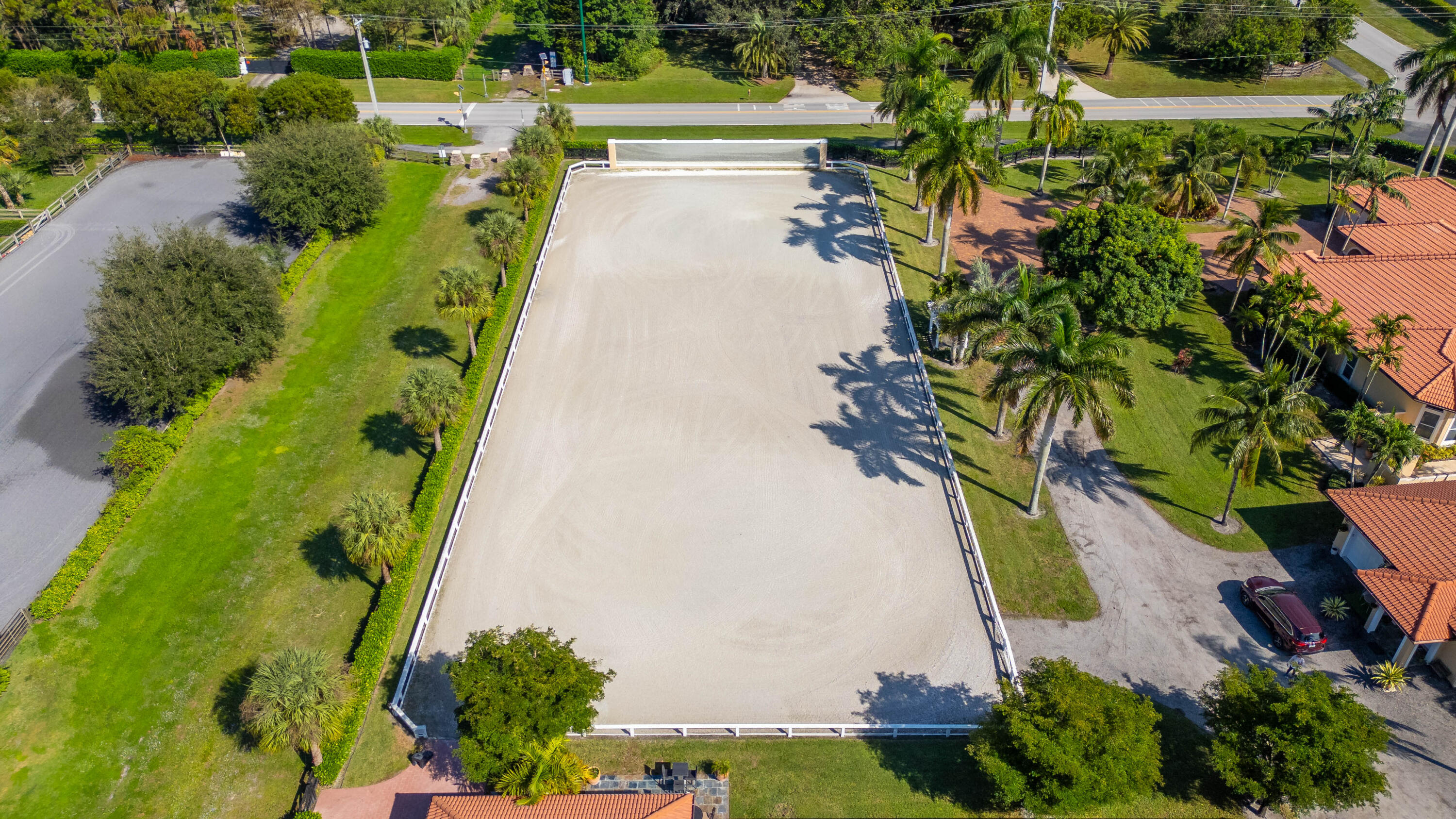 14943 Paddock Drive, Unit STALLS AND ) Wellington, FL 33414 - Photo 39 of 41 a view of a yard with plants and large trees