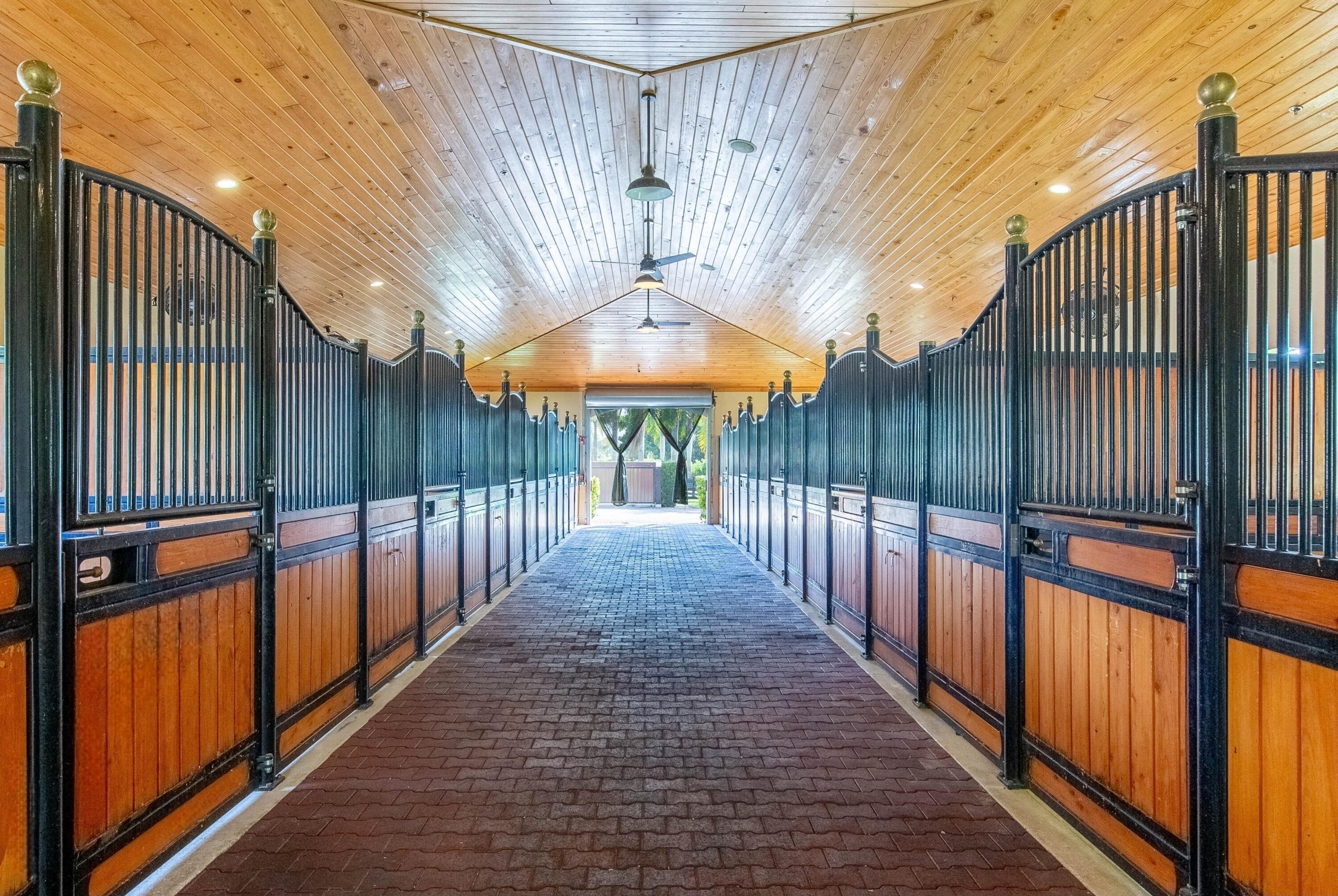 14943 Paddock Drive, Unit STALLS AND ) Wellington, FL 33414 - Photo 7 of 41 a view of a porch with wooden floor