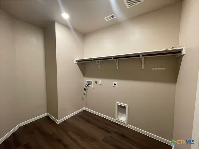 an empty room with wooden floor