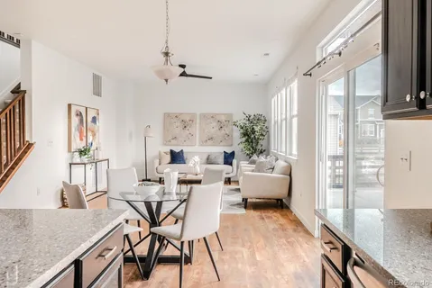 a view of a dining room with furniture window and wooden floor