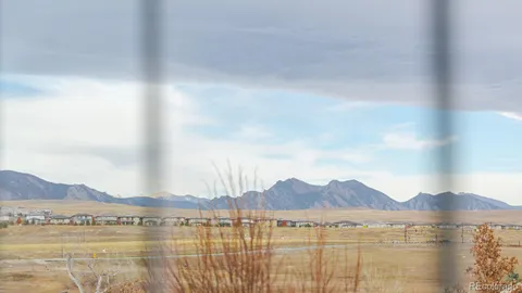 a view of an ocean with a mountain
