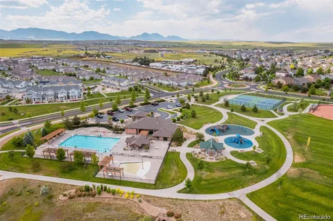 an aerial view of residential building and ocean view