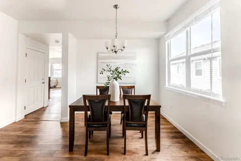 a view of a dining room with furniture window and wooden floor