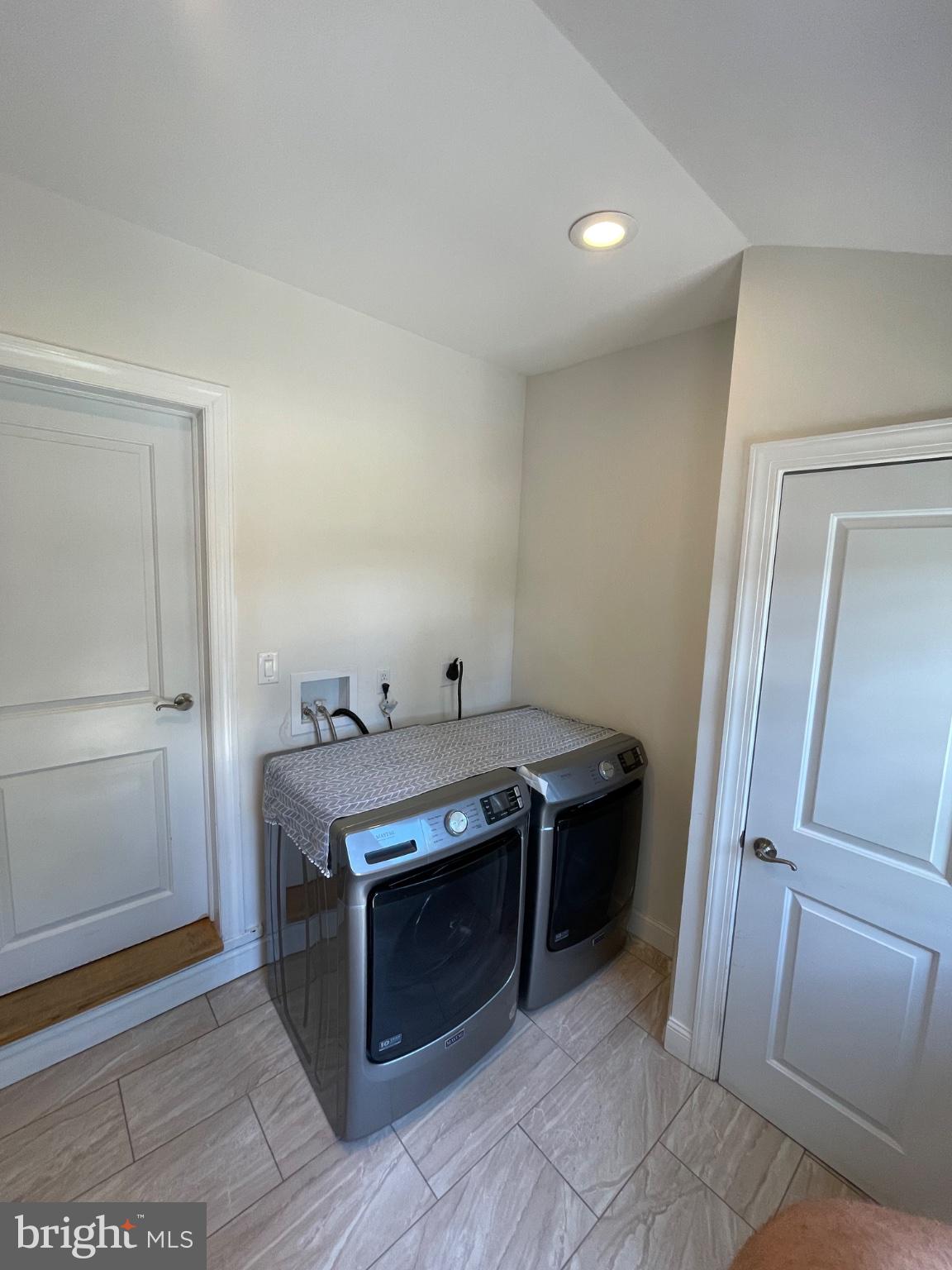 8129 Pine Road Philadelphia, PA 19111 - Photo 40 of 40 Modern laundry space with sleek appliances.