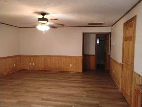 a view of a livingroom with wooden floor