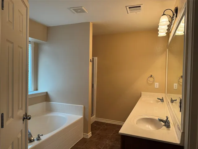 a bathroom with a sink and mirror