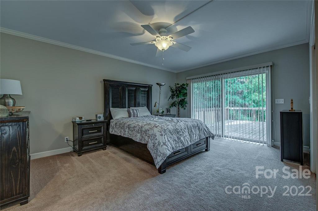1909 3 Lakes Road Shelby, NC 28150 - Photo 22 of 48 a bedroom with a large bed and a tv