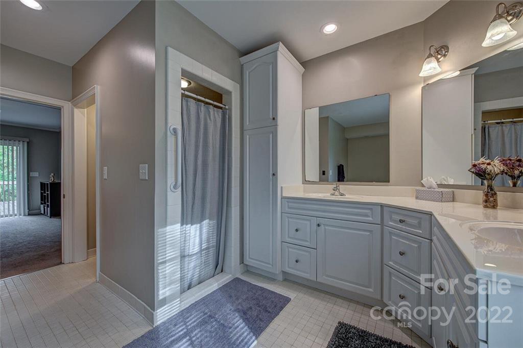 1909 3 Lakes Road Shelby, NC 28150 - Photo 24 of 48 a spacious bathroom with a granite countertop sink a mirror and shower
