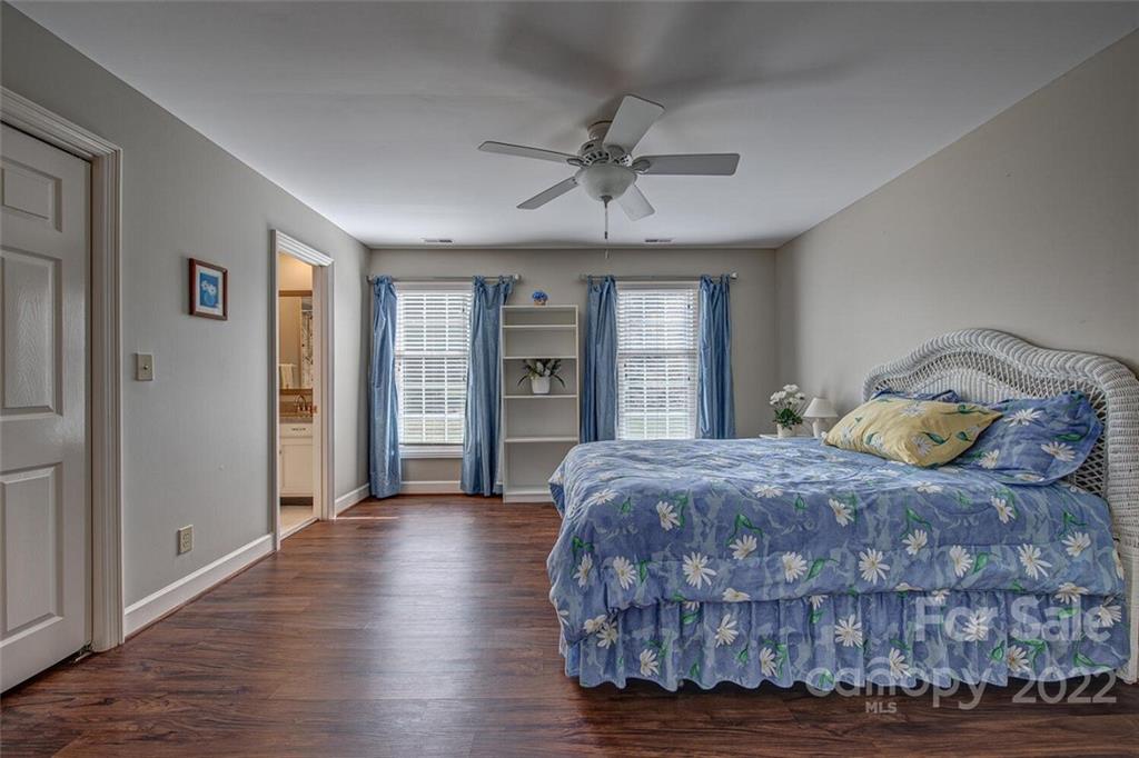 1909 3 Lakes Road Shelby, NC 28150 - Photo 30 of 48 a bedroom with a large bed wooden floor and window