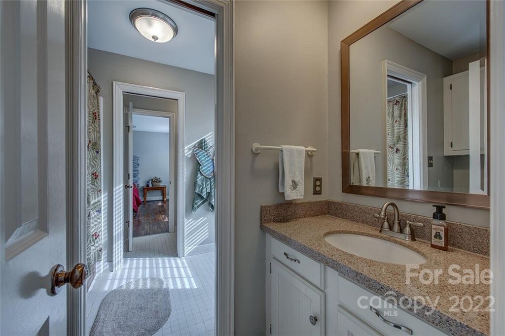 1909 3 Lakes Road Shelby, NC 28150 - Photo 31 of 48 a bathroom with a sink and mirror