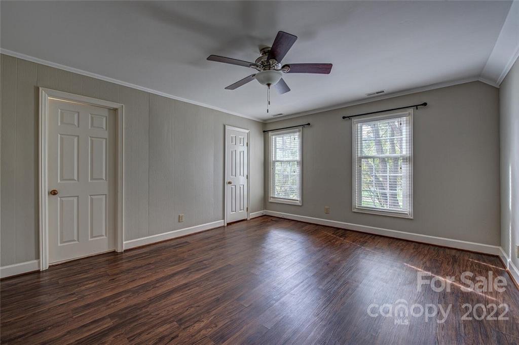 1909 3 Lakes Road Shelby, NC 28150 - Photo 33 of 48 a view of an empty room with wooden floor and a window