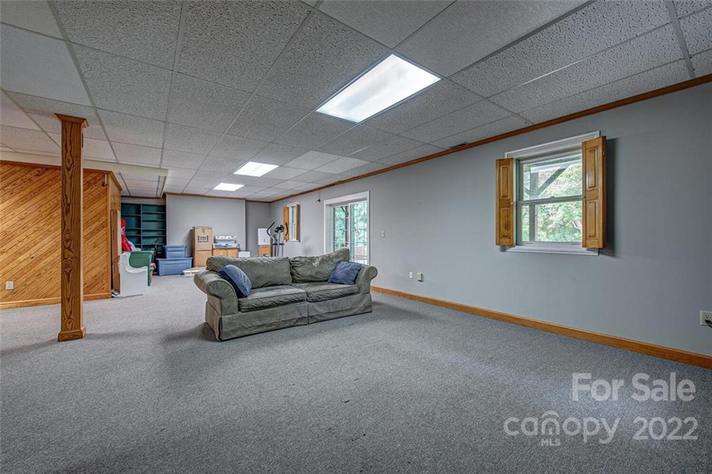 1909 3 Lakes Road Shelby, NC 28150 - Photo 36 of 48 a living room with furniture and a flat screen tv