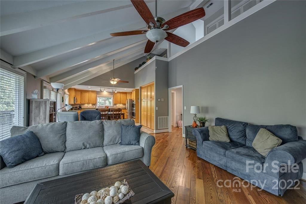 1909 3 Lakes Road Shelby, NC 28150 - Photo 8 of 48 a living room with furniture and a chandelier