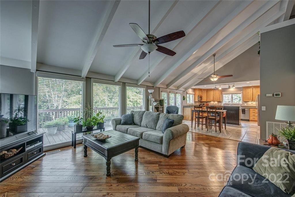 1909 3 Lakes Road Shelby, NC 28150 - Photo 10 of 48 a living room with furniture a flat screen tv and a large window