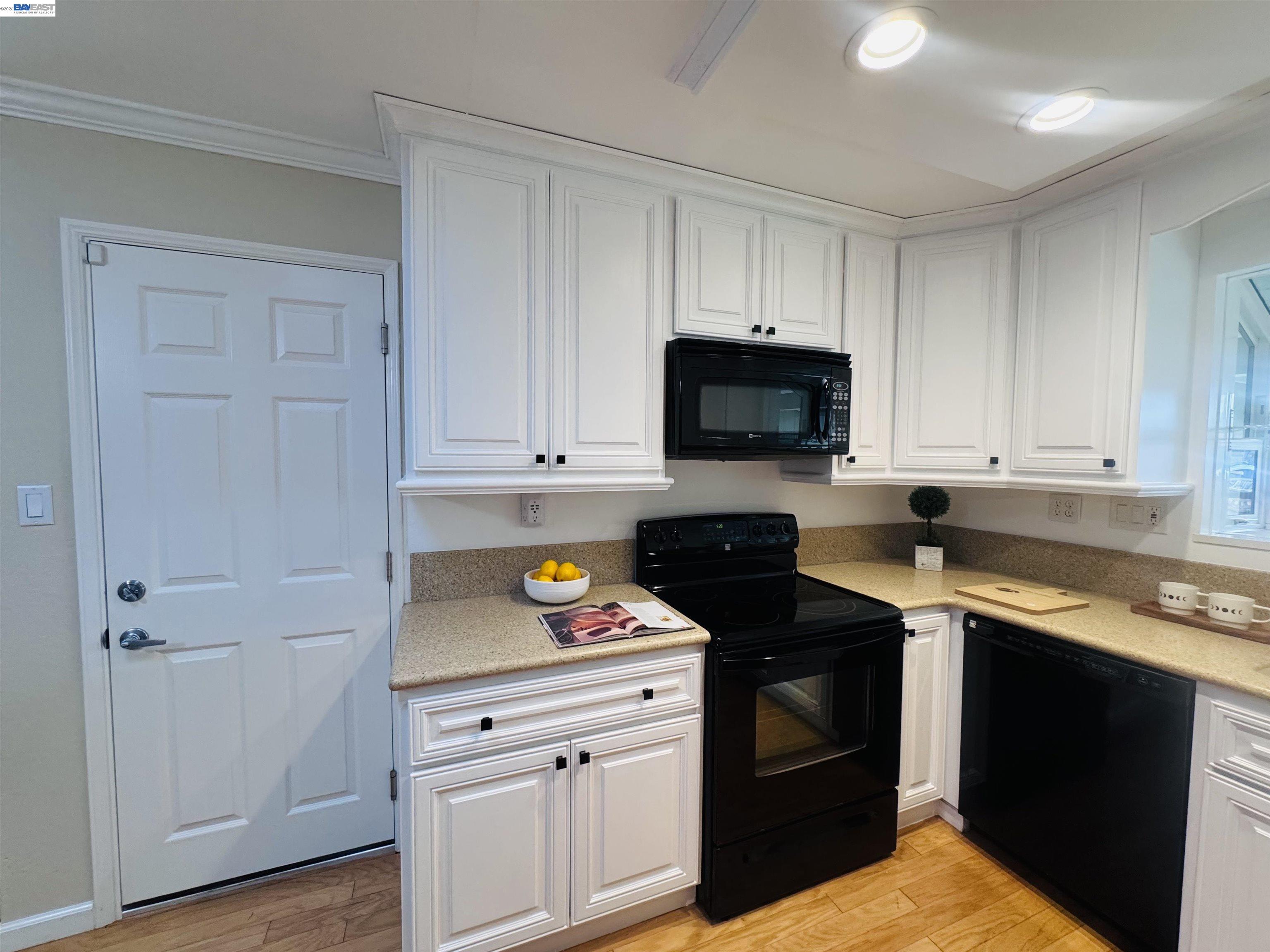 32301 Ruth Court Union City, CA 94587 - Photo 6 of 32 a kitchen with a stove and a microwave