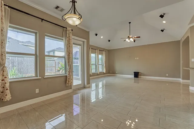 a kitchen with granite countertop a refrigerator and a sink