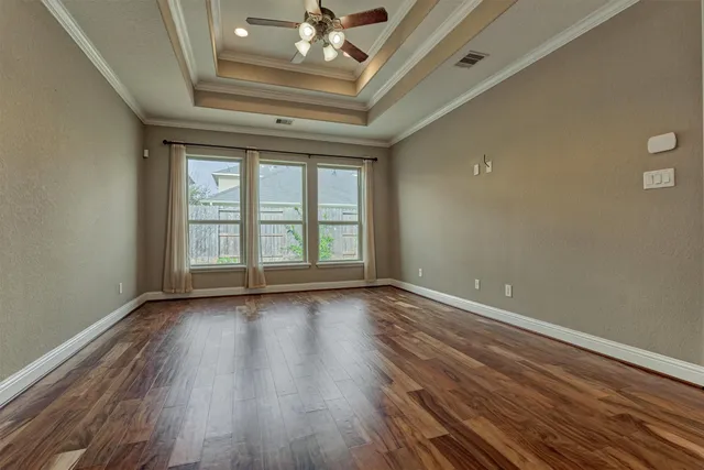 a bathroom with a granite countertop tub sink and mirror